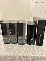 Front view of all five SFF desktop PCs standing upright