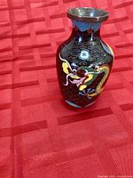 Front view showing dragon motif and brass rim