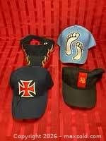 Group shot of four caps showing designs and colors