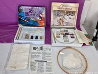 Both silk painting kits open displaying contents