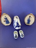 Group view showing frames, coin bank clog, and miniature clogs