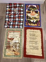 Four linen tea towels laid out showing designs