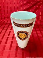 Full view of porcelain vase showing shape, decoration and height