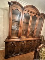 Front view showing full credenza hutch, glass doors, lower cabinets