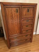 front view of solid wood armoire closed