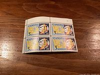 Front view of corner block showing four 5¢ Meteorology stamps with selvage