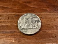 Reverse of 1982 Canadian Constitution dollar coin displaying design and date