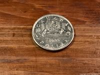 Reverse of 1985 Canadian dollar showing Voyageur canoe design