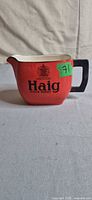 Front view showing Haig logo and orange glaze