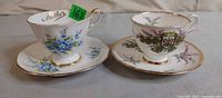 Both teacup and saucer sets side by side