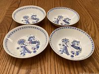 Four Figgjo Lotte cereal bowls showing interior decoration and rim border.