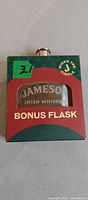 Front of boxed Jameson hip flask
