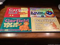 Front covers of the four Garfield comic books