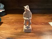 Front view of hand-carved wood figure