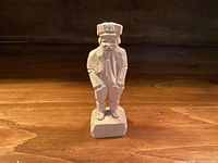 Front view of carved wood figure