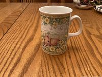 Front of Royal Doulton Woodland Friends mug showing single rabbit and floral design