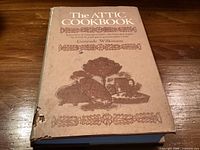 Front cover of The Attic Cookbook showing title, author and jacket wear