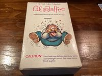 Front of slipcase with cartoon artwork and caution text