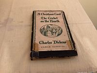 Damaged slipcase showing title, author and series