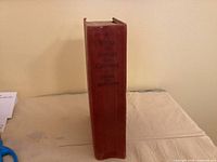 Spine view showing red cloth cover and title
