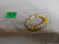 Full view of bracelet on plastic bag