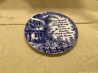 Front of Burleigh ironstone plate showing blue cottage scene and verse