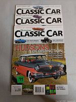 All three Hemmings Classic Car magazines stacked showing cover art and issue variety