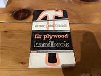 Front cover of Fir Plywood handbook showing title and hammer graphic
