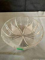 top angled view showing starburst base, paneled sides, scalloped rim