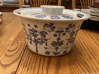 Side view of covered casserole showing Lotte pattern