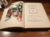 Open book showing title page with bibliographic details