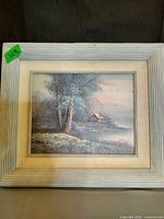 Full view of framed landscape painting