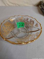 top view showing three compartments, gold floral overlay, scalloped gilt rim