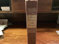 Spine view of Gone With The Wind hardcover showing author, title, publisher