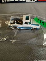 Side and top view of Hot Wheels Custom ’62 Chevy pickup in plastic bag