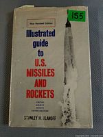 Front cover showing title, author, rocket illustration