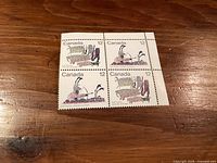 Front view of mint block of four 12¢ Inuit Hunter Canadian stamps, full perforations and gum visible