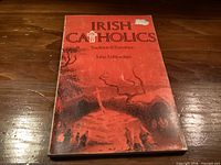 Front cover of the paperback book showing title, author and cover wear