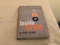 Front cover of Inside the Atom book showing title, author, edition and dust jacket condition