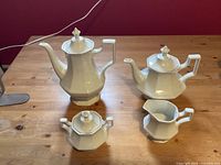 Full view of coffee pot, teapot, creamer and sugar bowl