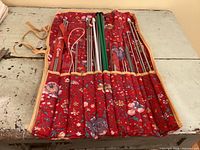 Case opened showing organized rows of assorted knitting needles