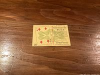 Front of vintage Macdonald's promotional playing card showing 4 of Diamonds design