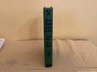 Spine view showing title, author, publisher and cloth binding