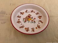 Top view showing Teddy Bear pattern and red rim