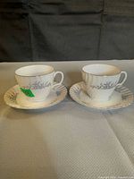 Front view of both teacups on their saucers showing pattern and form