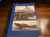 Front cover with title and three wartime images