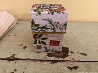 Closed musical Christmas gift box showing exterior design and jeweled lid