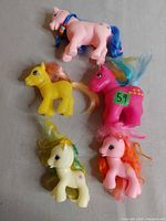 Group of five My Little Pony figures laid out