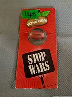 Front view of packaged Human Bean seed showing Stop Wars graphic