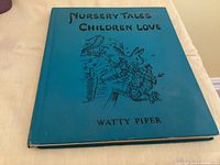 Front cover of blue cloth hardcover showing title and author